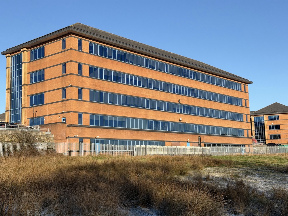 Modern multi‑storey commercial office building, reflecting the type of property asset lenders remain comfortable supporting in 2026.